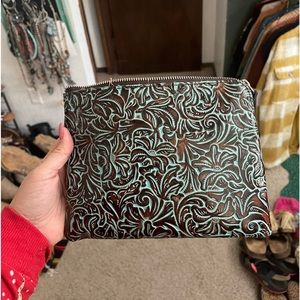 Tooled leather clutch